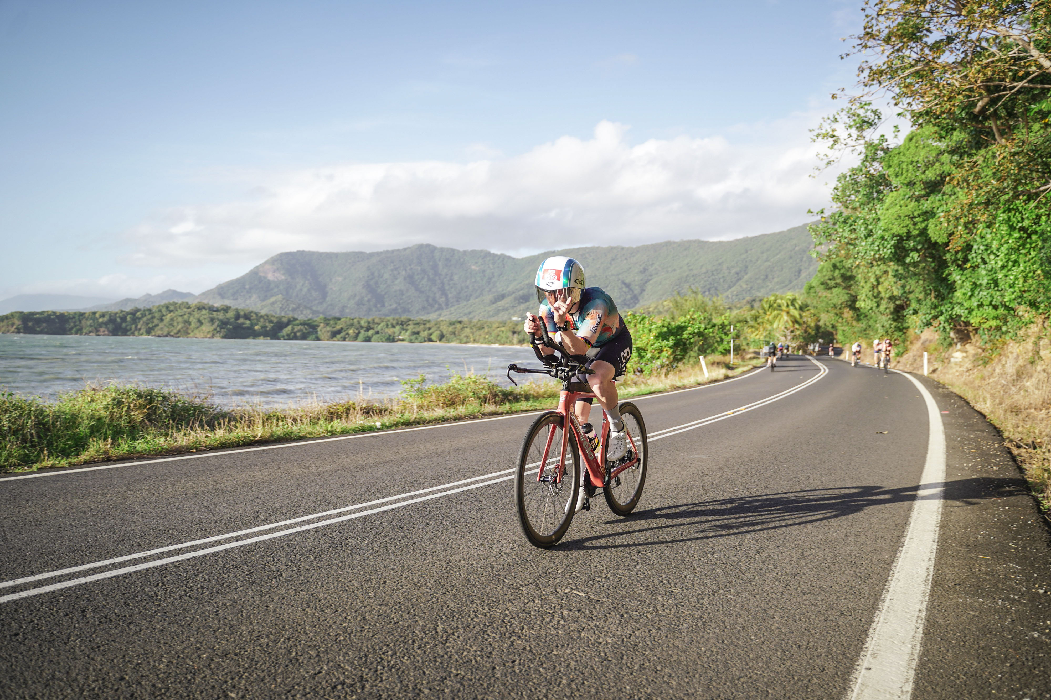 Aaron Imbach on the bike leg of IRONMAN 70.3 Cairns, coast road
