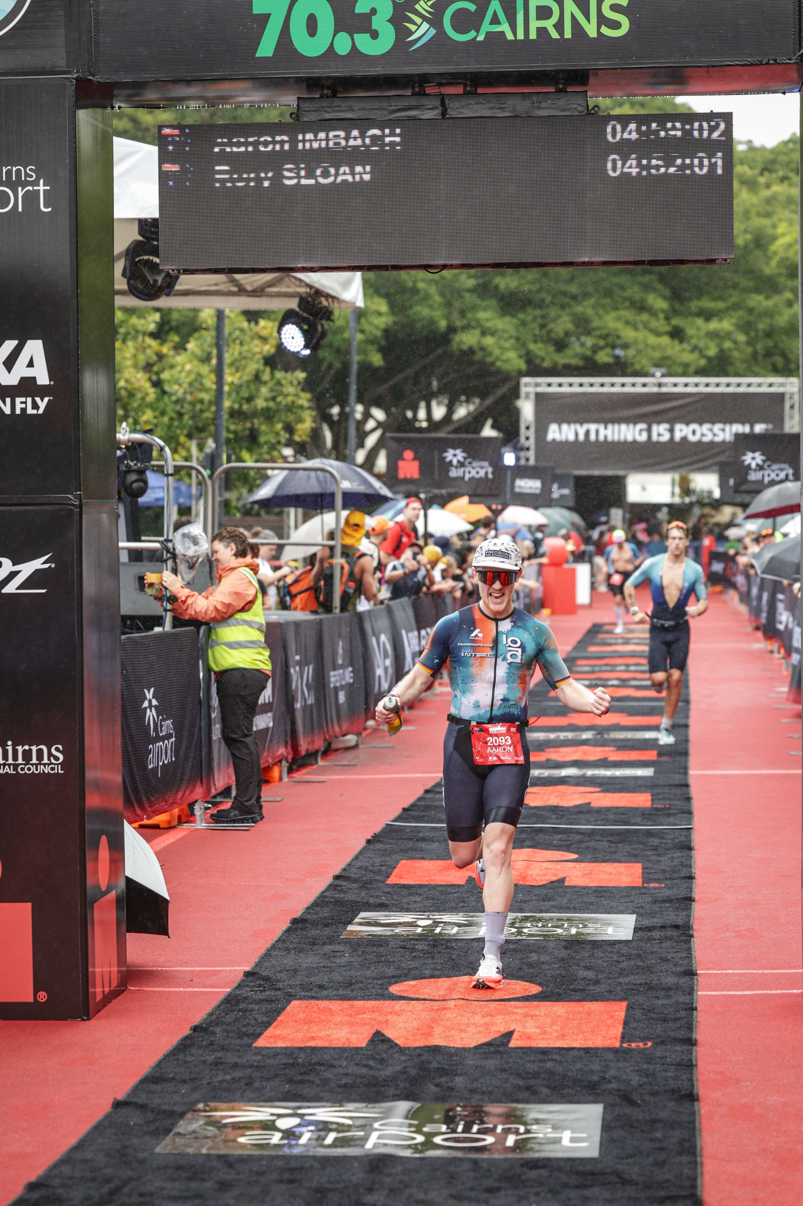 Aaron Imbach crosses the IRONMAN 70.3 Cairns finish line in 04:09:02